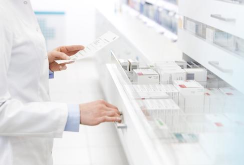 Pharmacist pulls med from drawer