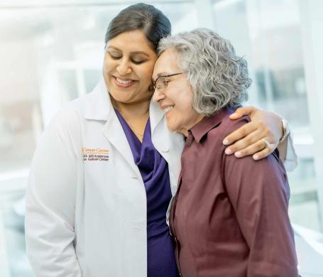 UT Health San Antonio MD Anderson Cancer Center doctor hugs a patient